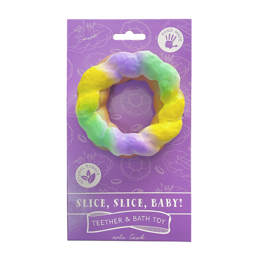 Purple packaging of a teether and bath toy with a colorful king cake design on a white background.