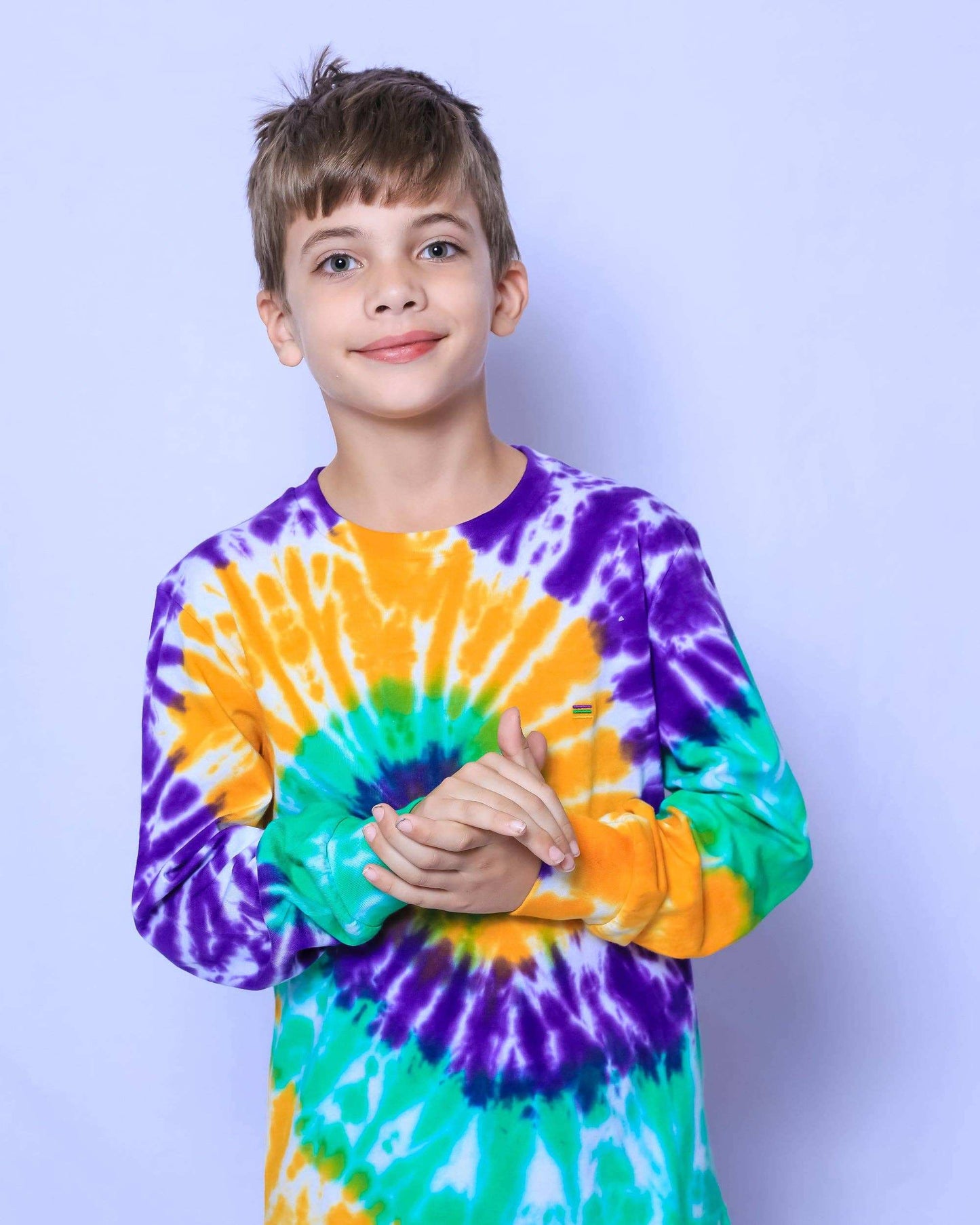 Vibrant purple, green, and gold tie dye swirl youth long sleeve shirt for Mardi Gras celebrations.