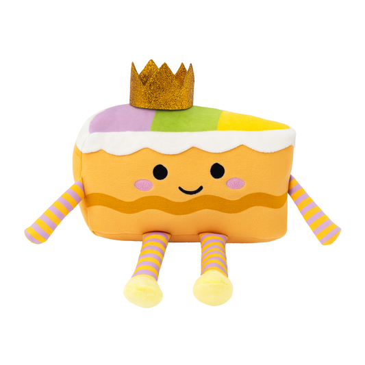 Plush toy resembling a slice of cake with a crown on a white background