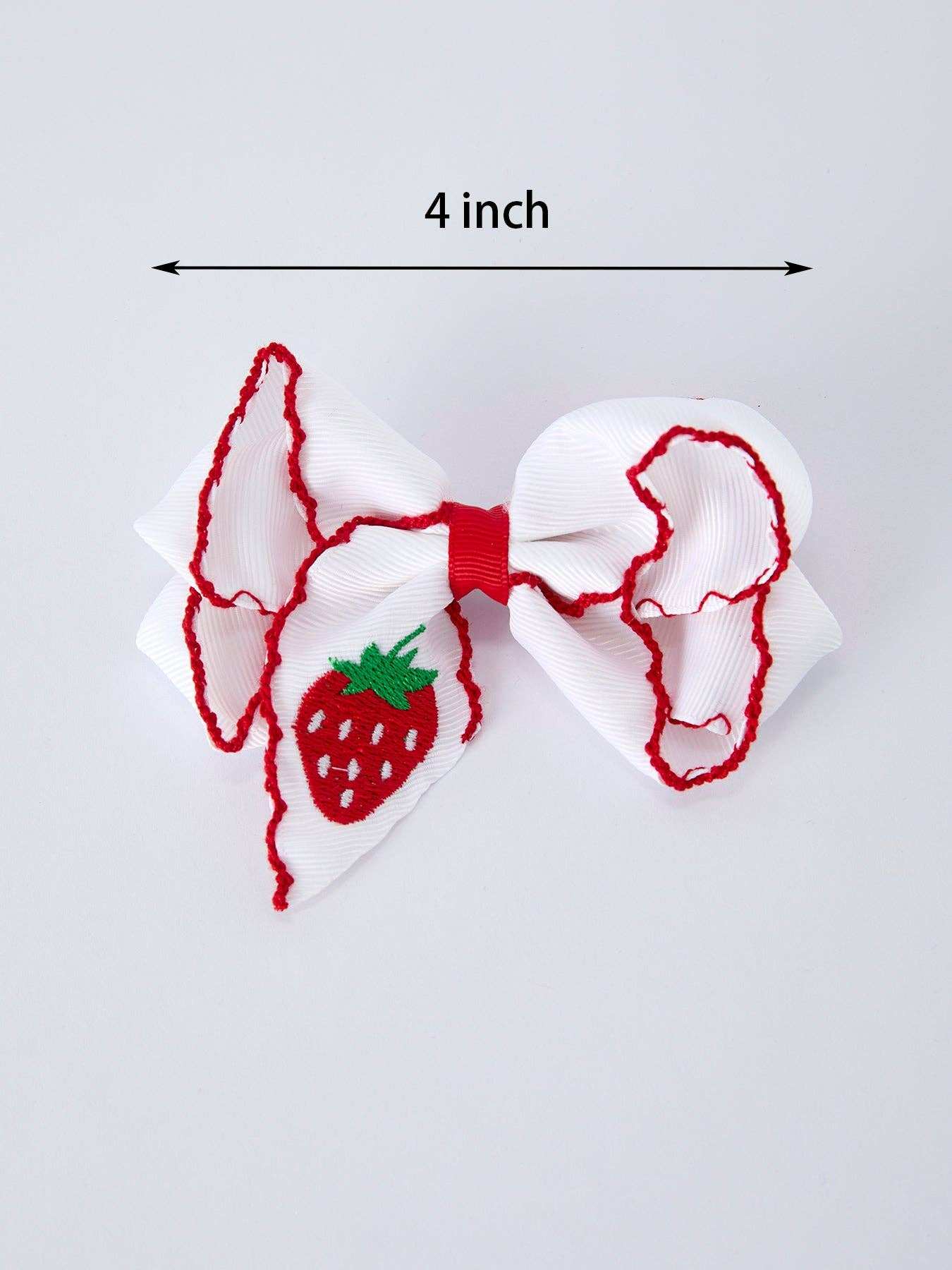 Strawberry embroidered white hair bow detail view