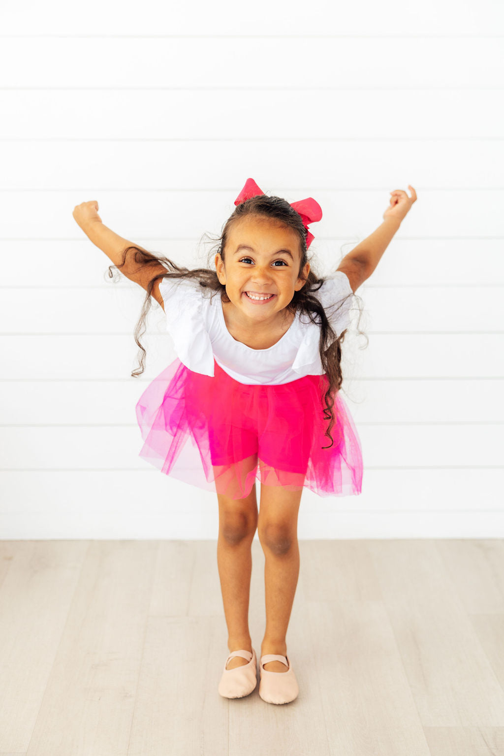 Hot pink tutu shorts side view