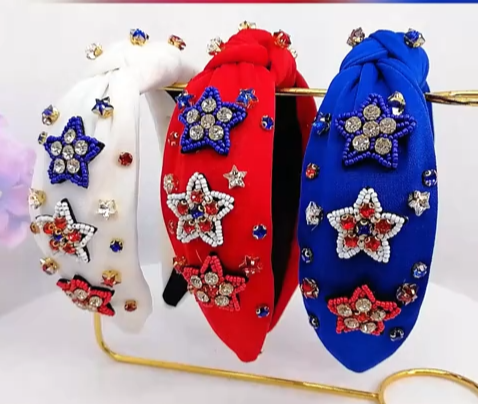 Fourth of July headbands with red, white, and blue rice beads and star designs.